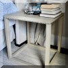 F21. Faux hide wrapped side table with nail head trim. 